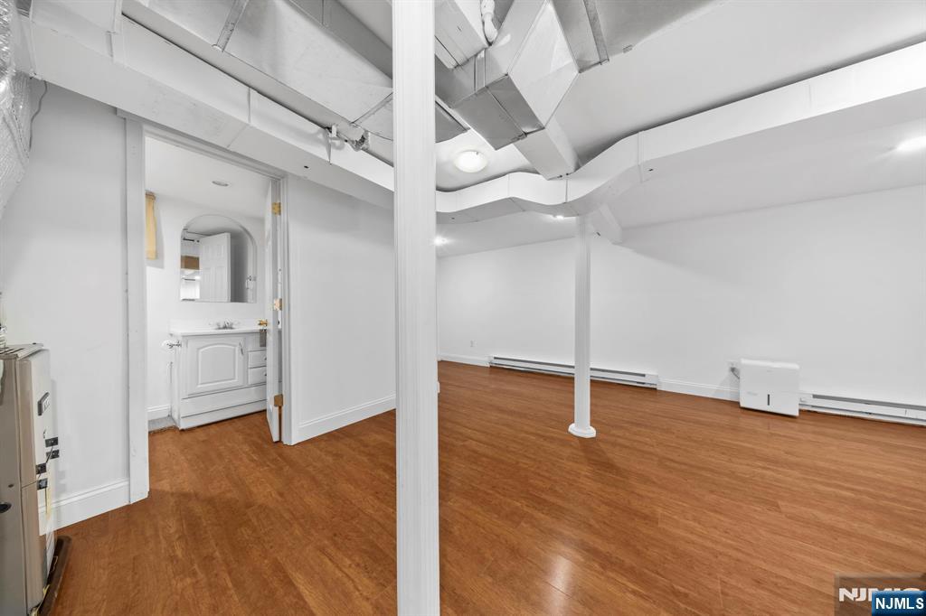 62 Sycamore Road Dumont, NJ 07628 - Photo 25 of 43 a view of empty room with wooden floor
