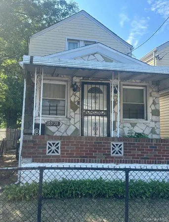 a front view of a house with garage