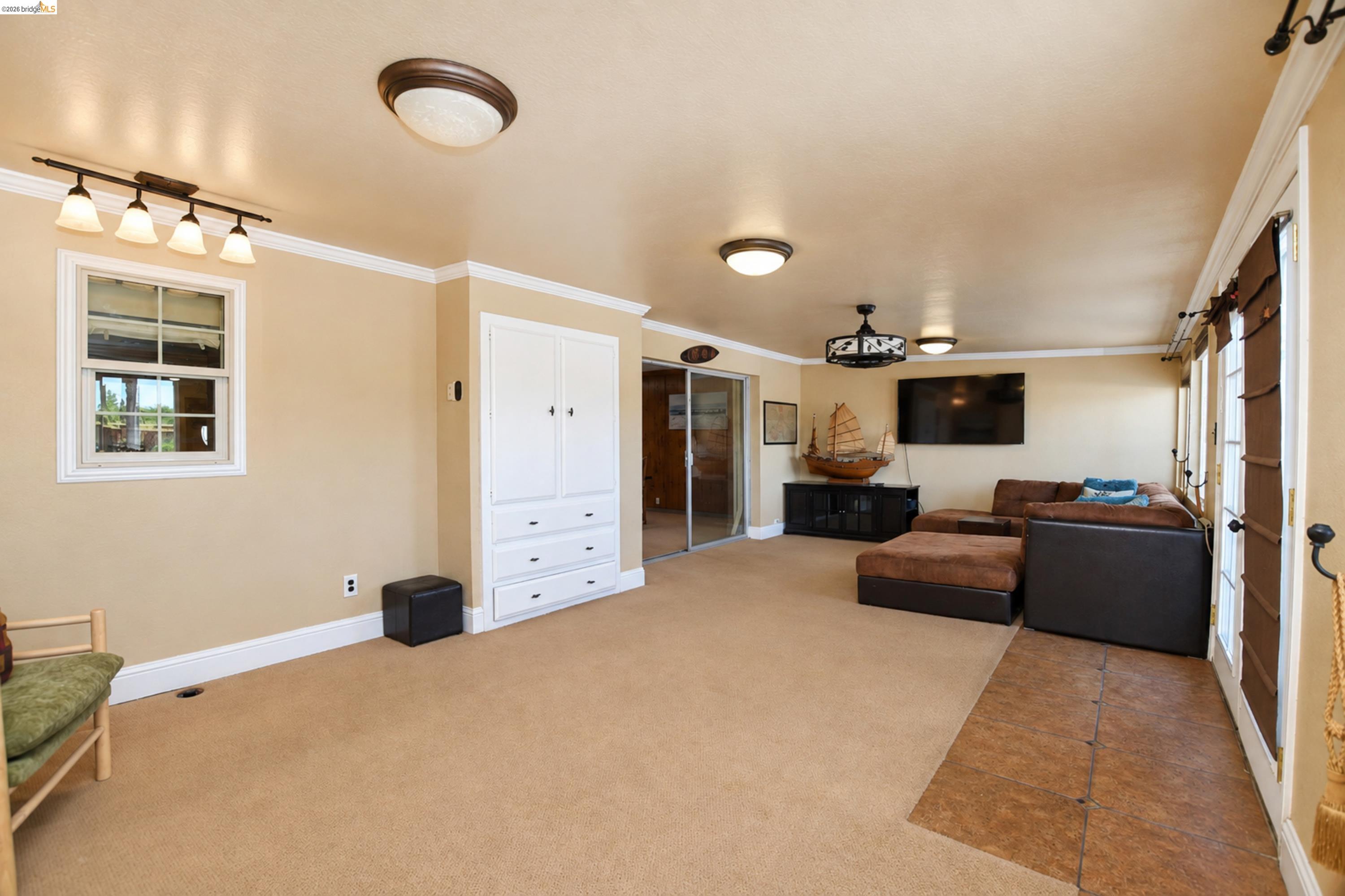 340 West Bolton Road Oakley, CA 94561 - Photo 28 of 87 Neutral wall tones with white trim, built-in cabinetry, dual flush-mount ceiling lights, and a track light fixture
