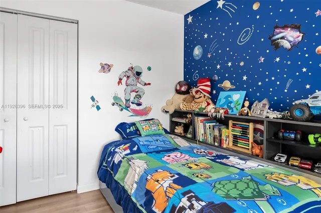 a bedroom with a bed and a tv in it