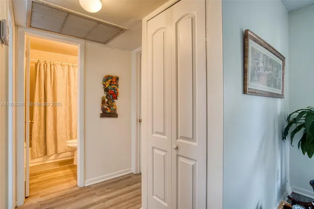 a view of front door with wooden floor