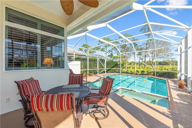 a view of a chairs and table in the balcony