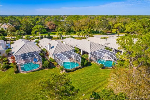 an aerial view of residential houses with outdoor space