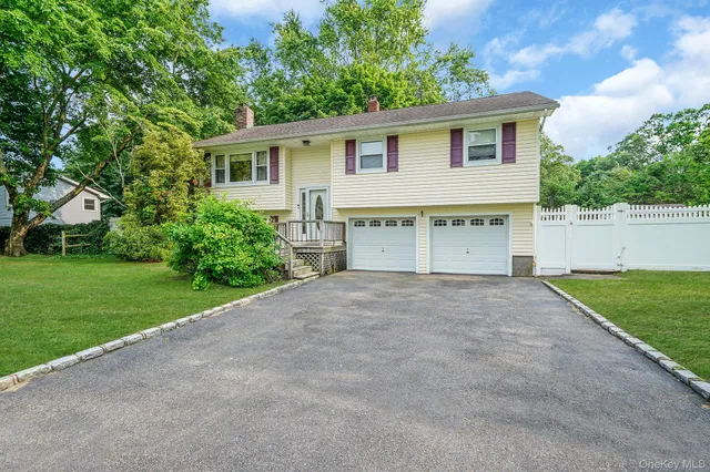 a house with a yard and a garage