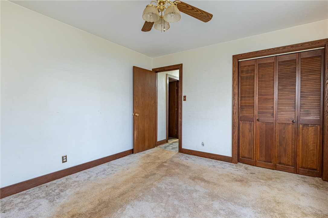 6885 Garber Road Clayton, OH 45415 - Photo 13 of 24 This spacious bedroom offers ample natural light and a comfortable atmosphere for rest and relaxation.