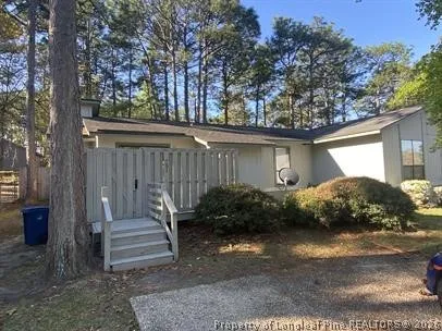 a view of a house with backyard and garden
