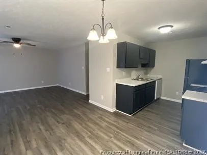 a view of kitchen with microwave and stove