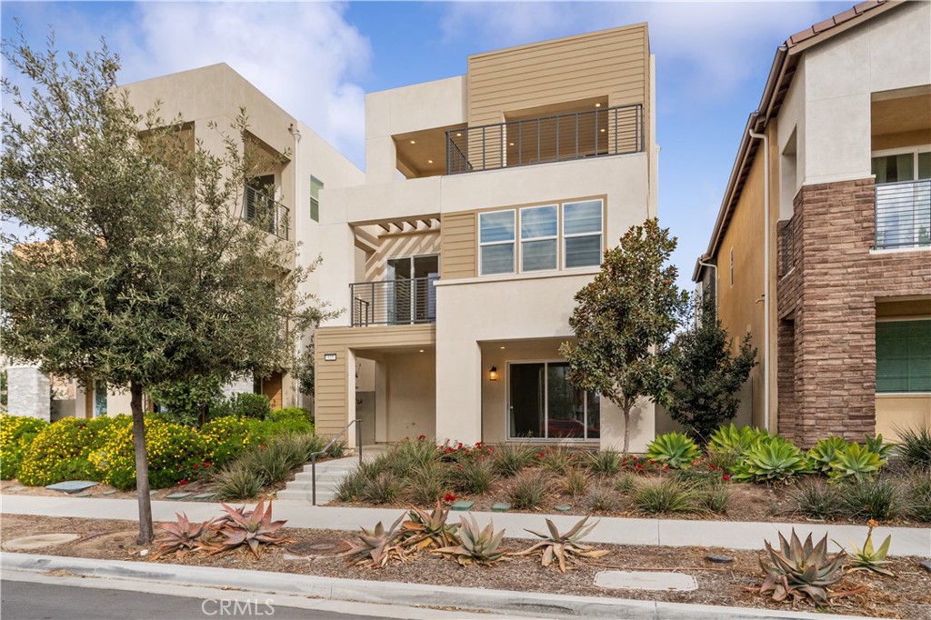 a front view of a building with garden