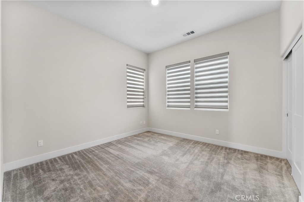 115 Rondo Irvine, CA 92618 - Photo 11 of 28 a view of an empty room with a window