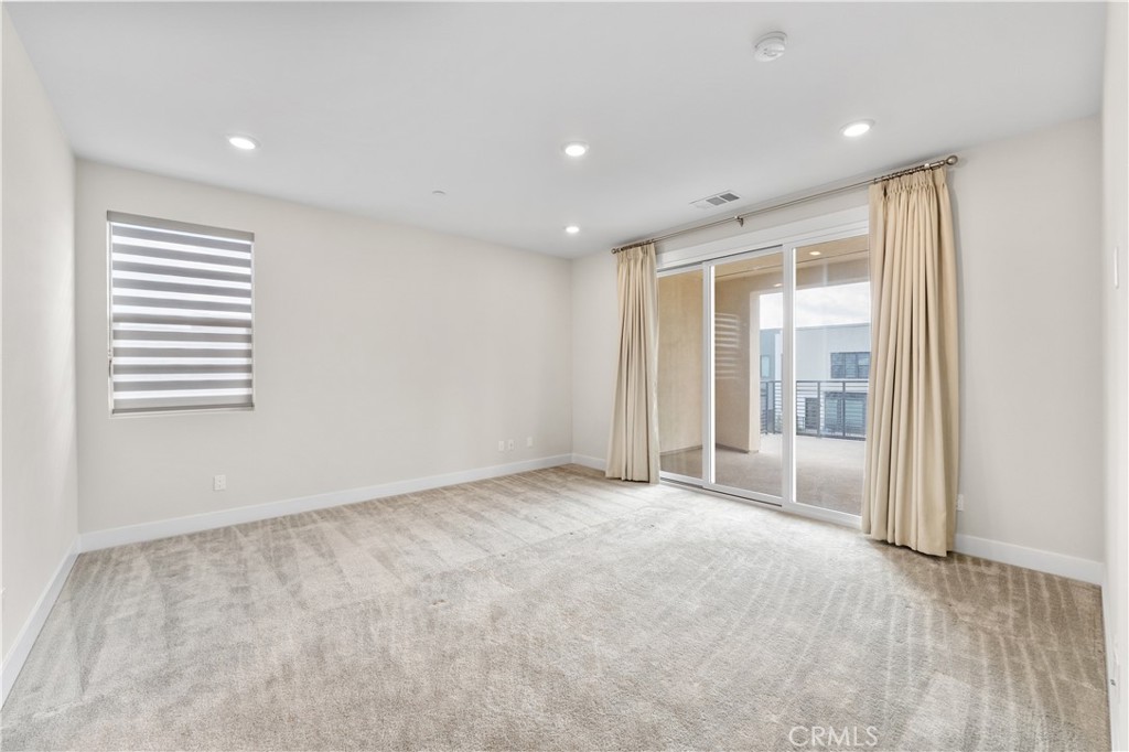 115 Rondo Irvine, CA 92618 - Photo 15 of 28 a view of an empty room with a window