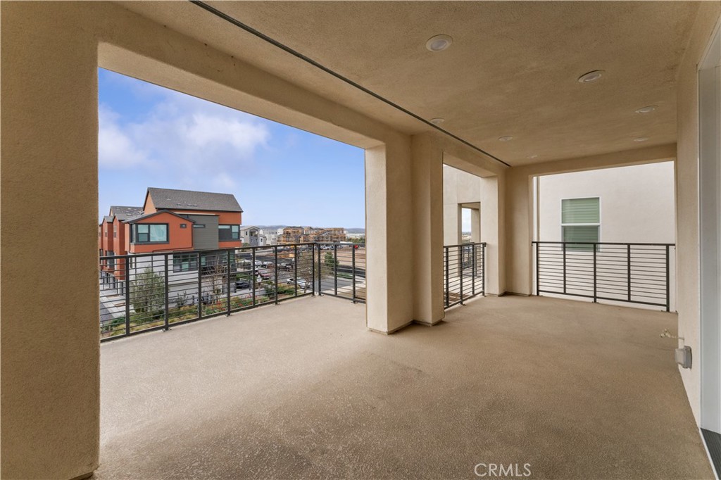 115 Rondo Irvine, CA 92618 - Photo 19 of 28 a view of an empty room with a balcony