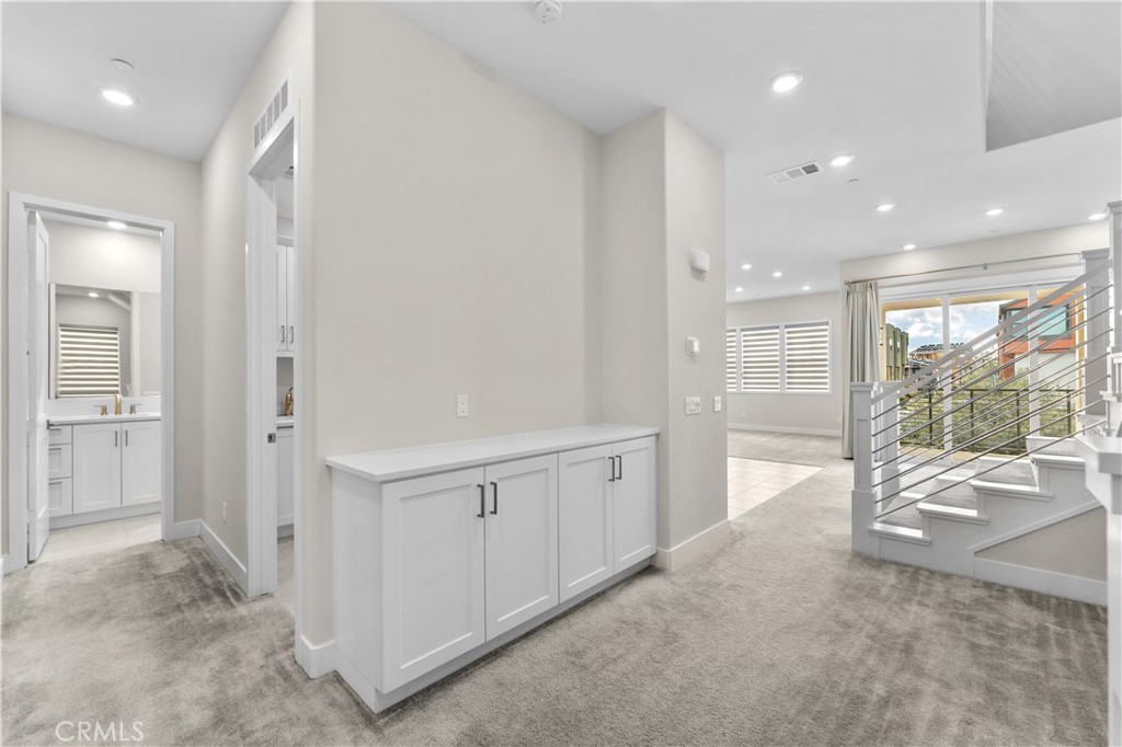 115 Rondo Irvine, CA 92618 - Photo 5 of 28 a view of a room with large windows