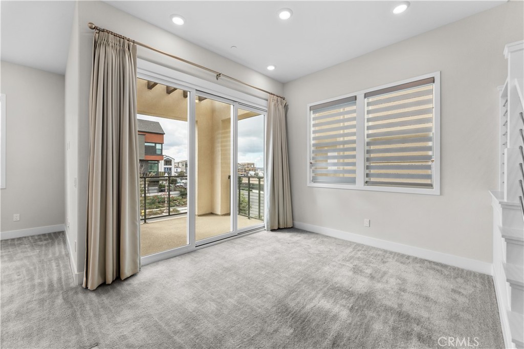 115 Rondo Irvine, CA 92618 - Photo 8 of 28 a view of an empty room with glass door