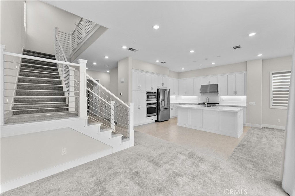 115 Rondo Irvine, CA 92618 - Photo 9 of 28 a view of kitchen with furniture and windows