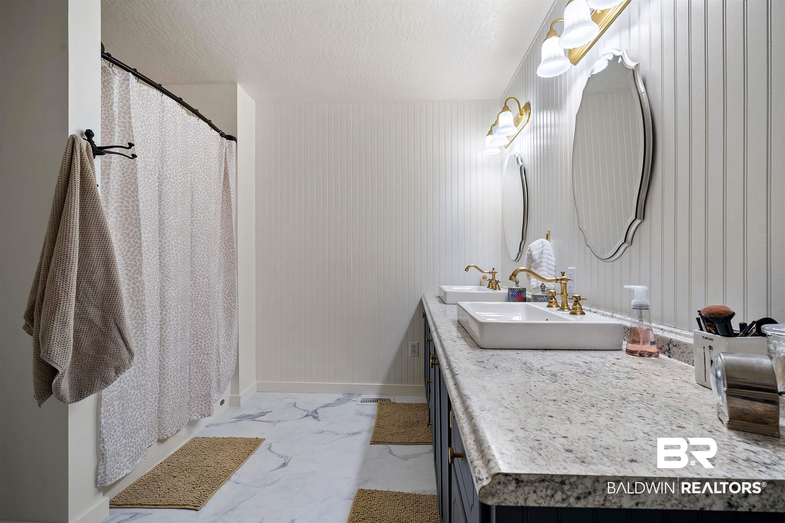22 Horace Odom Road Millry, AL 36558 - Photo 21 of 39 Full bathroom featuring a shower with shower curtain, double vanity, and light marble finish flooring