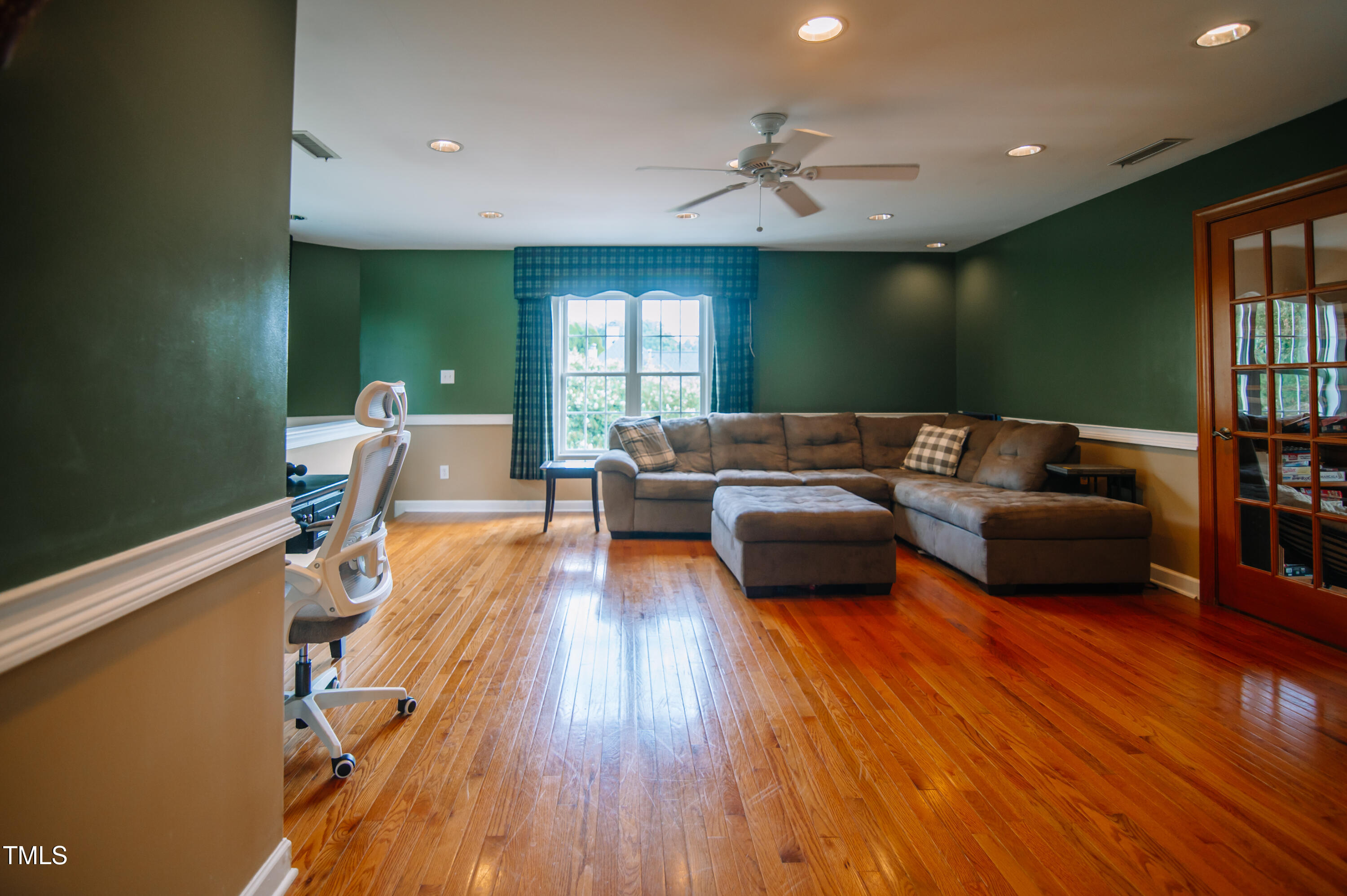 12223 Penrose Trail Raleigh, NC 27614 - Photo 16 of 21 a living room with furniture and a wooden floor