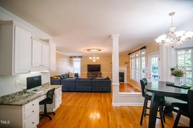 a large kitchen with stainless steel appliances granite countertop a stove and cabinets