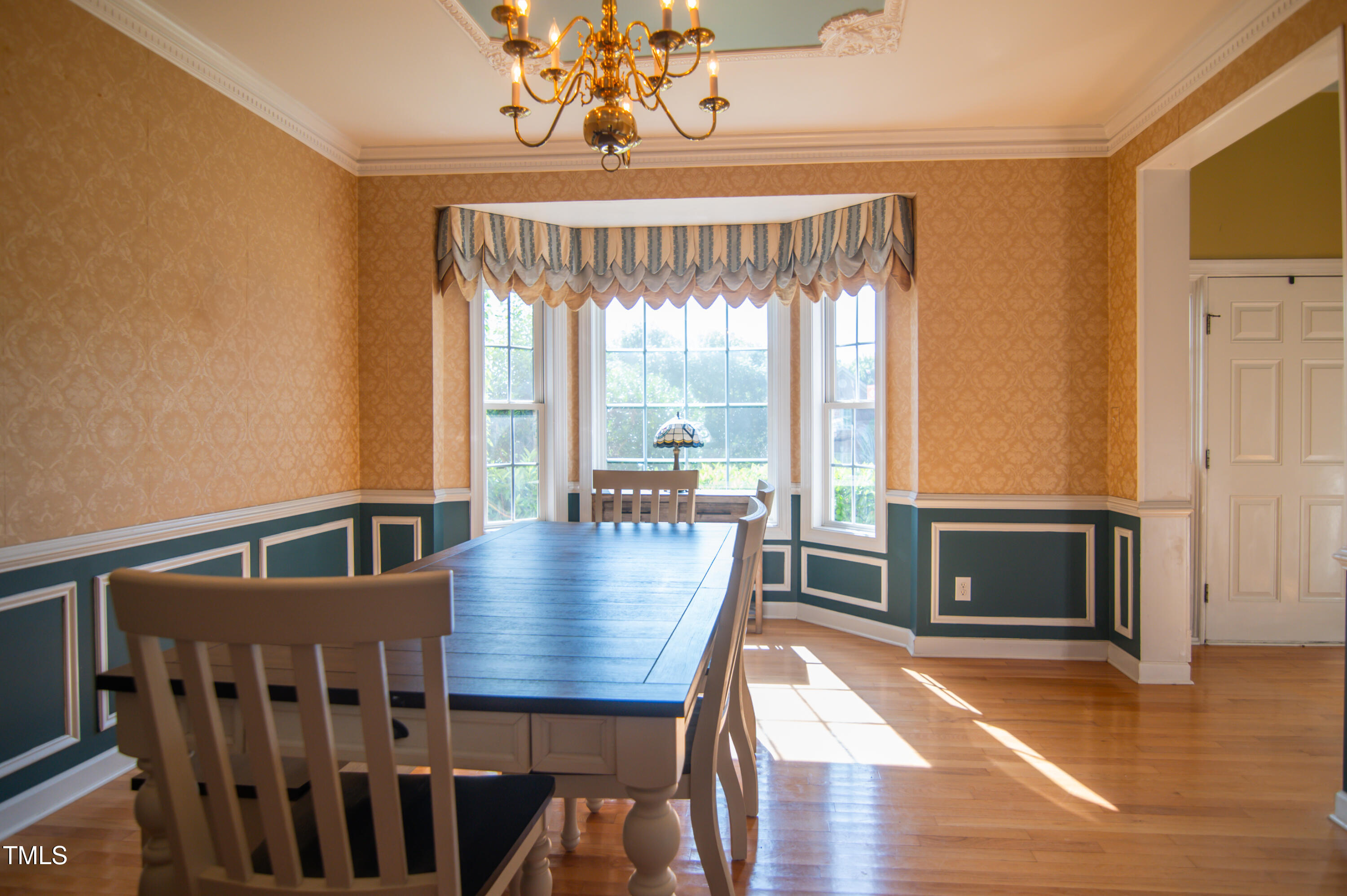 12223 Penrose Trail Raleigh, NC 27614 - Photo 10 of 21 a view of a dining room with furniture window and wooden floor