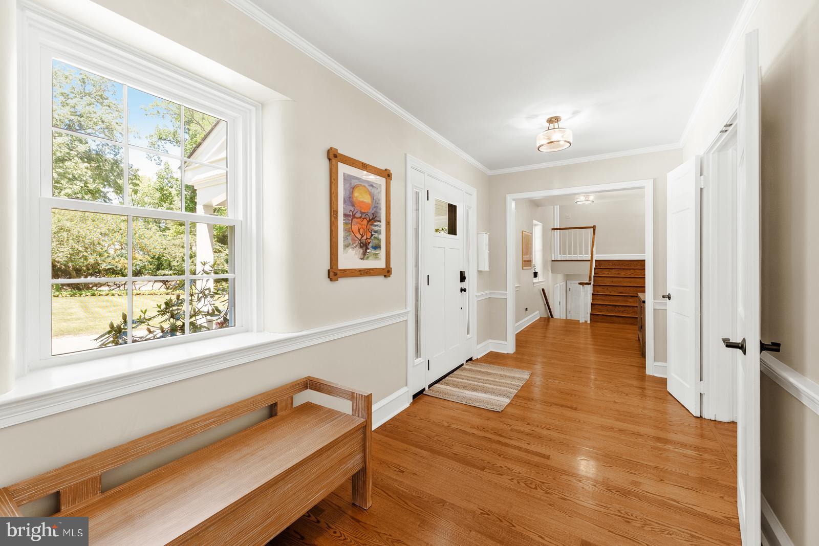 1700 Old Welsh Road Huntingdon Valley, PA 19006 - Photo 20 of 105 a hallway with a large window and wooden floor