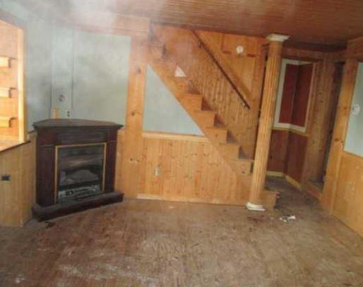 826 Parkwood Road Pittsburgh, PA 15210 - Photo 5 of 9 a view of an empty room with a fireplace