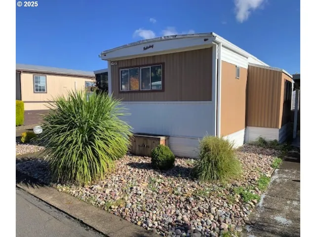 a couple of potted plants in front of door