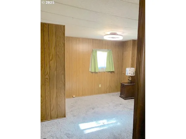 a view of a livingroom with wooden floor