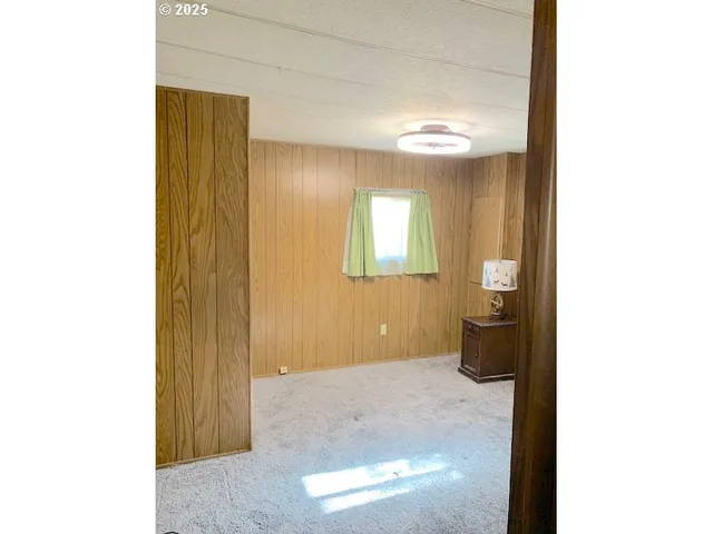 a view of a livingroom with wooden floor