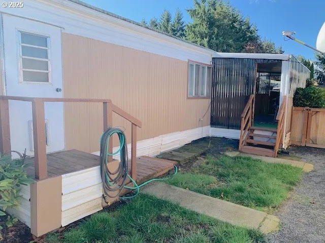 a backyard of a house with table and chairs