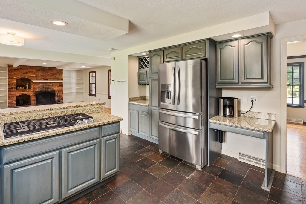 17 Bittersweet Lane Wilbraham, MA 01095 - Photo 16 of 40 a kitchen with stainless steel appliances granite countertop a stove refrigerator and cabinets