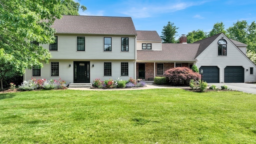 17 Bittersweet Lane Wilbraham, MA 01095 - Photo 2 of 40 a front view of a house with a garden