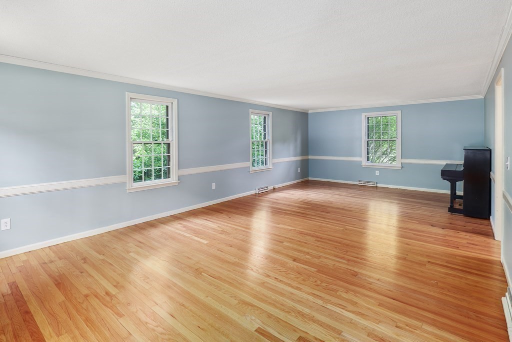 17 Bittersweet Lane Wilbraham, MA 01095 - Photo 21 of 40 an empty room with wooden floor and windows
