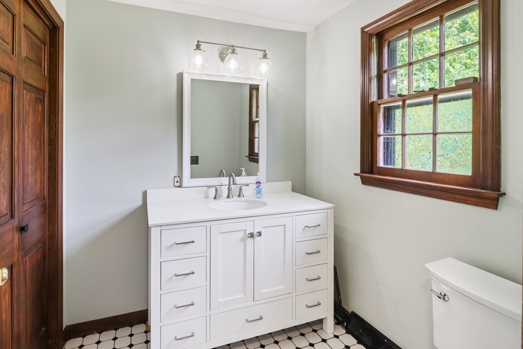 17 Bittersweet Lane Wilbraham, MA 01095 - Photo 23 of 40 a bathroom with a sink a toilet and a mirror