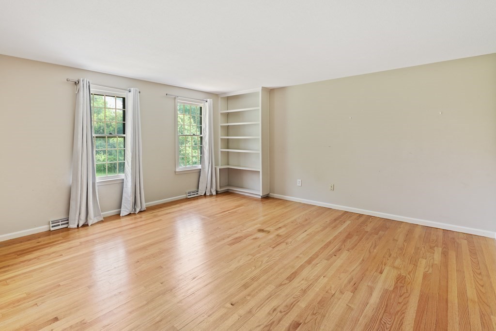 17 Bittersweet Lane Wilbraham, MA 01095 - Photo 24 of 40 an empty room with wooden floor and windows