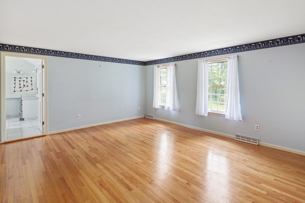 17 Bittersweet Lane Wilbraham, MA 01095 - Photo 26 of 40 wooden floor in an empty room with a window