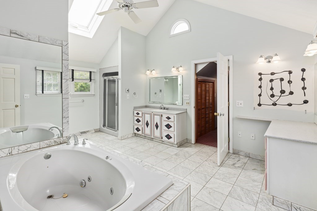 17 Bittersweet Lane Wilbraham, MA 01095 - Photo 28 of 40 a bathroom with a bathtub sink and mirror
