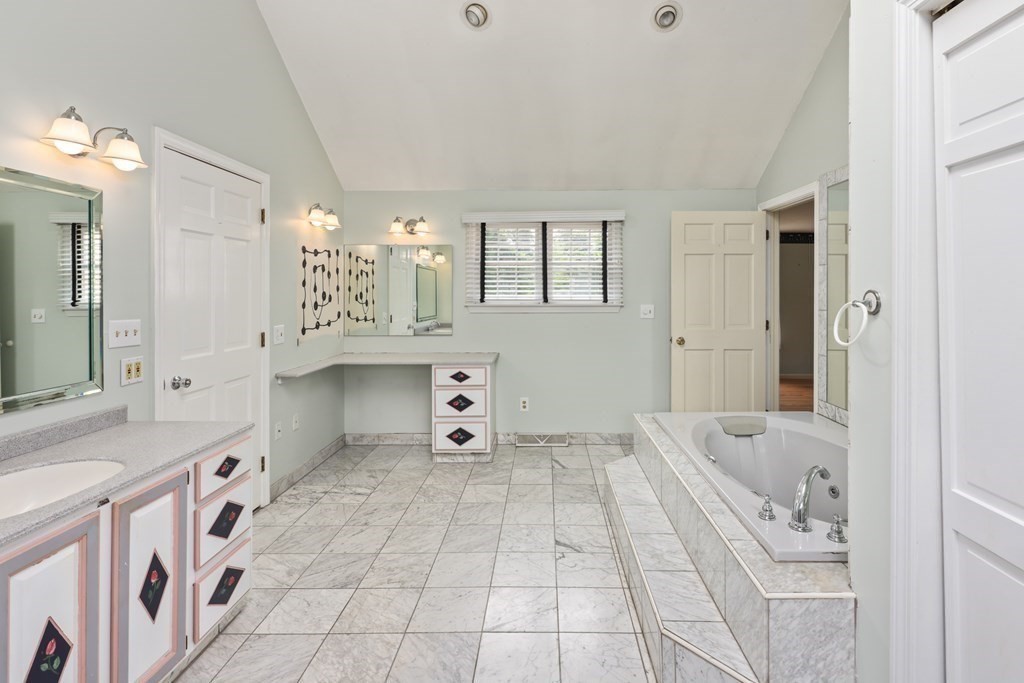 17 Bittersweet Lane Wilbraham, MA 01095 - Photo 30 of 40 a bathroom with a bathtub sink and mirror
