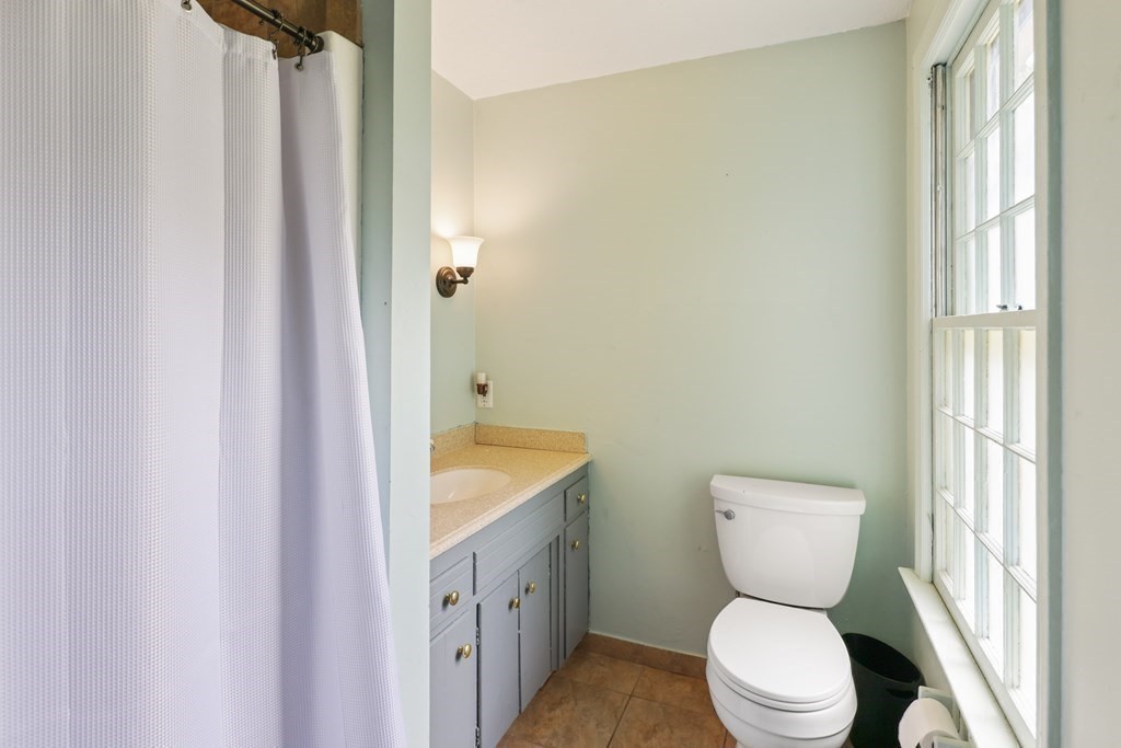 17 Bittersweet Lane Wilbraham, MA 01095 - Photo 35 of 40 a bathroom with a toilet a sink and a window
