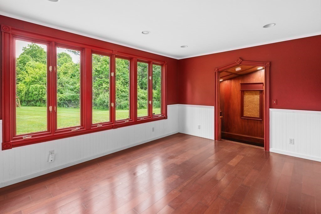 17 Bittersweet Lane Wilbraham, MA 01095 - Photo 36 of 40 a view of an empty room with a window and wooden floor
