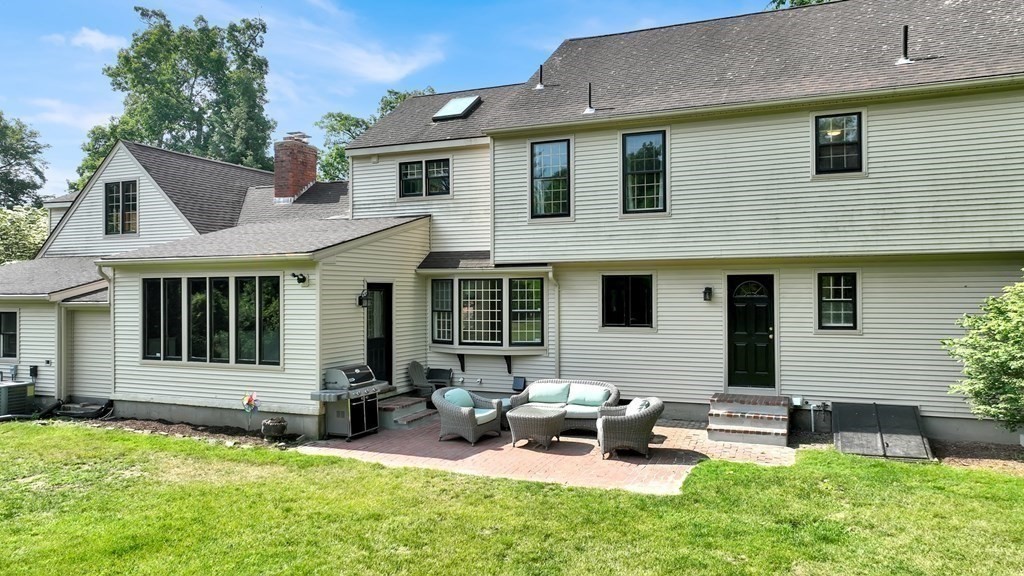 17 Bittersweet Lane Wilbraham, MA 01095 - Photo 4 of 40 a view of a house with a backyard and sitting area