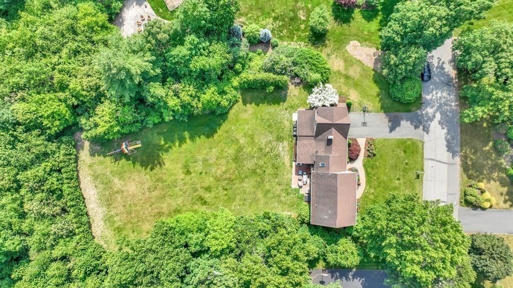 17 Bittersweet Lane Wilbraham, MA 01095 - Photo 8 of 40 an aerial view of a house with a yard and large trees