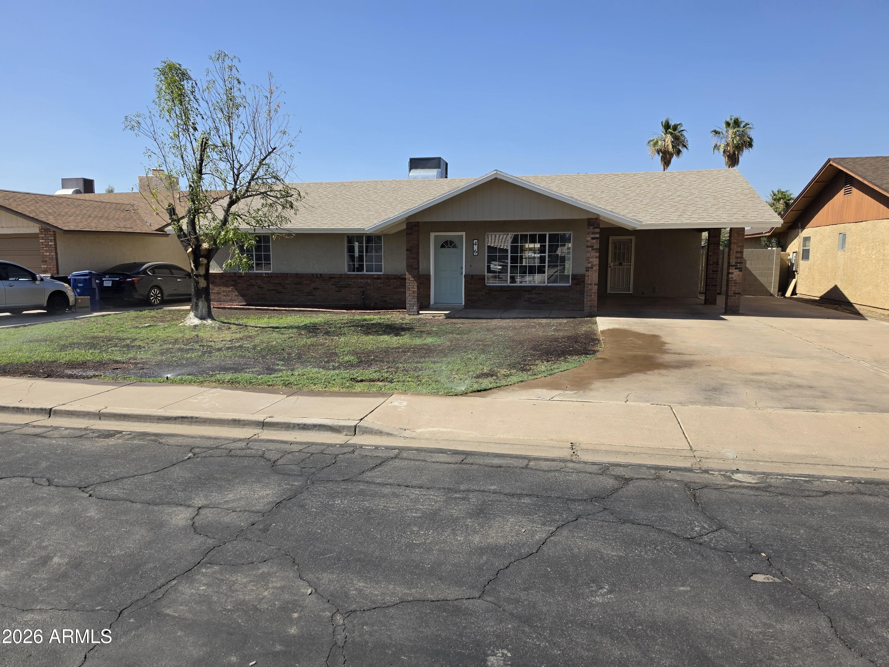 46 East McLellan Road Mesa, AZ 85201 - Photo 18 of 18 a front view of a house with a yard