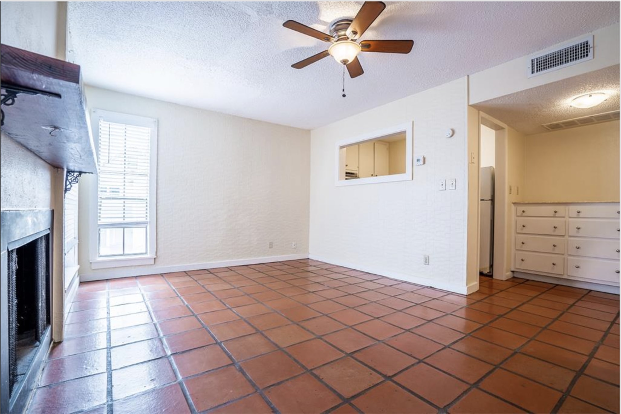 110 East 37th Street, Unit 103 Austin, TX 78705 - Photo 2 of 12 a view of a livingroom with an empty space and a window