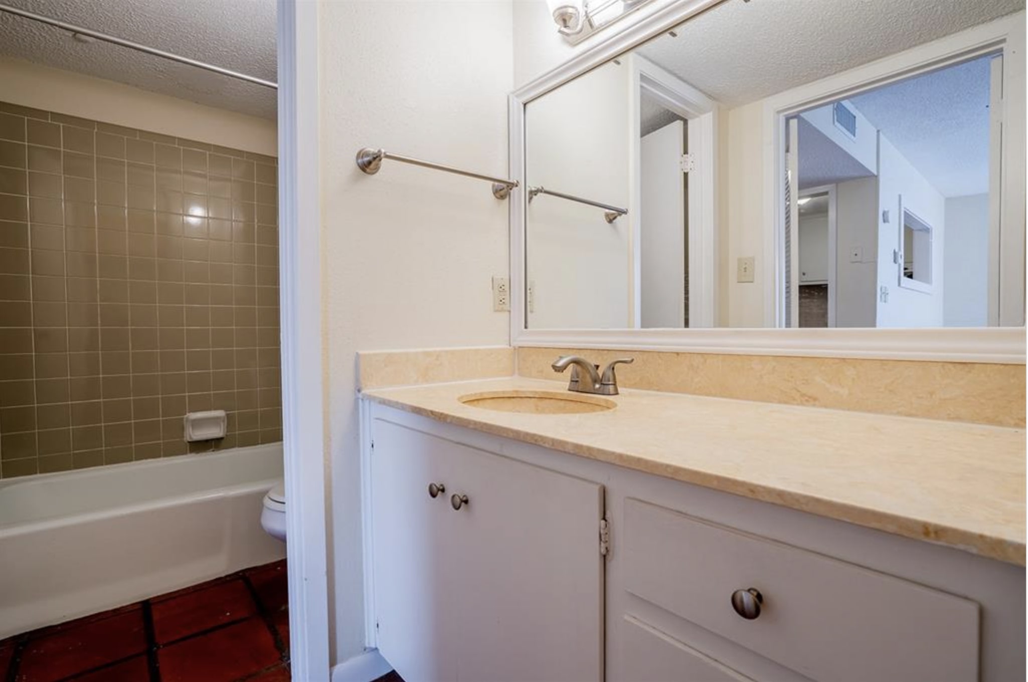 110 East 37th Street, Unit 103 Austin, TX 78705 - Photo 7 of 12 a bathroom with a sink and a bathtub