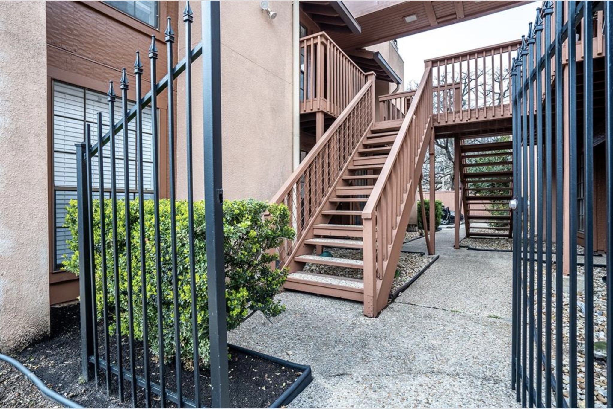 110 East 37th Street, Unit 103 Austin, TX 78705 - Photo 10 of 12 a view of entryway with wooden floor and stairs
