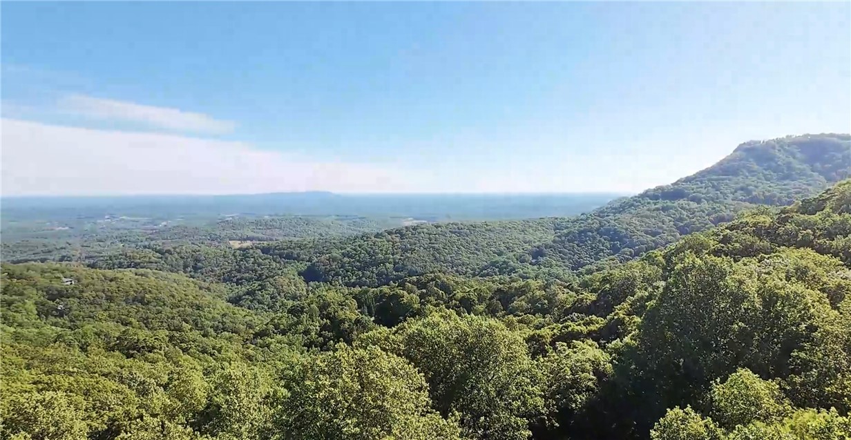 Lot 18 Raven Road Landrum, SC 29356 - Photo 1 of 7 A commanding view of verdant mountain ranges stretching to the distant horizon.