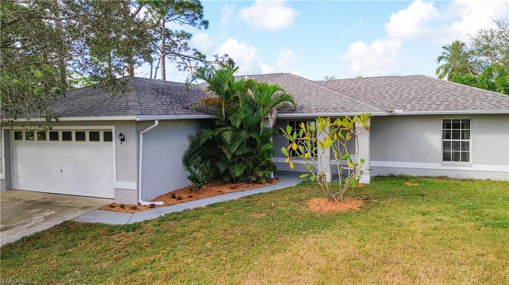 18282 Fern Road Fort Myers, FL 33967 - Photo 1 of 24 a front view of a house with garden