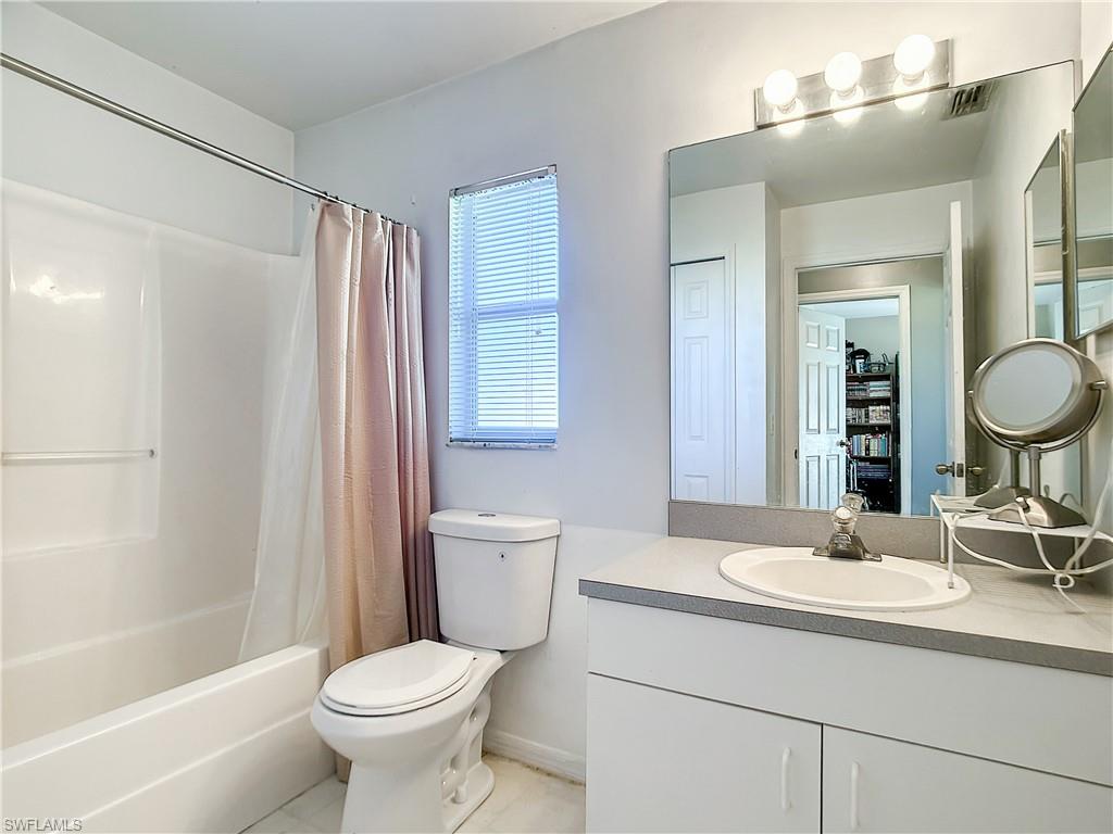18282 Fern Road Fort Myers, FL 33967 - Photo 12 of 24 a bathroom with a toilet sink and mirror
