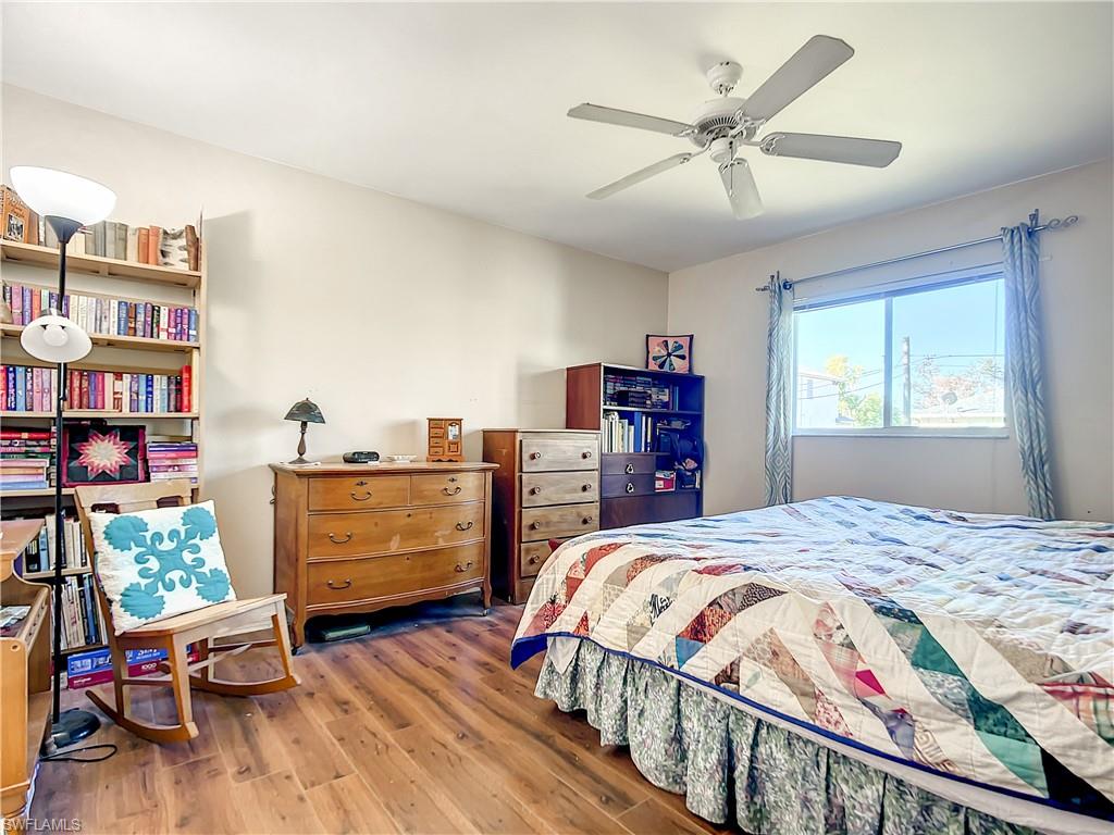 18282 Fern Road Fort Myers, FL 33967 - Photo 14 of 24 a bedroom with a bed and a bookshelf