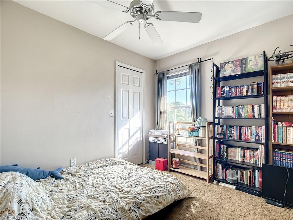 18282 Fern Road Fort Myers, FL 33967 - Photo 18 of 24 a bedroom with a bed and a book shelf