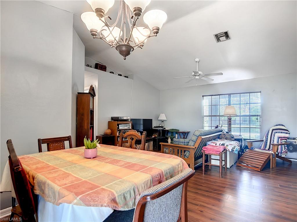 18282 Fern Road Fort Myers, FL 33967 - Photo 5 of 24 a view of a dining room with furniture and wooden floor